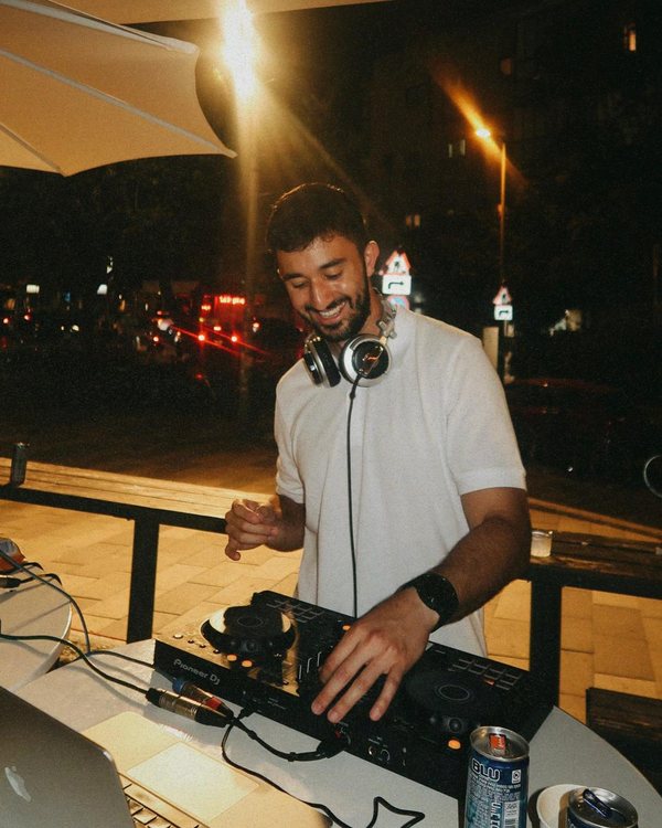 DALELAD behind the decks at an outdoor night set in Tel Aviv